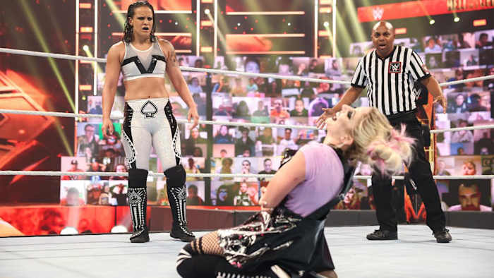Shayna Baszler stares at a cackling Alexa Bliss